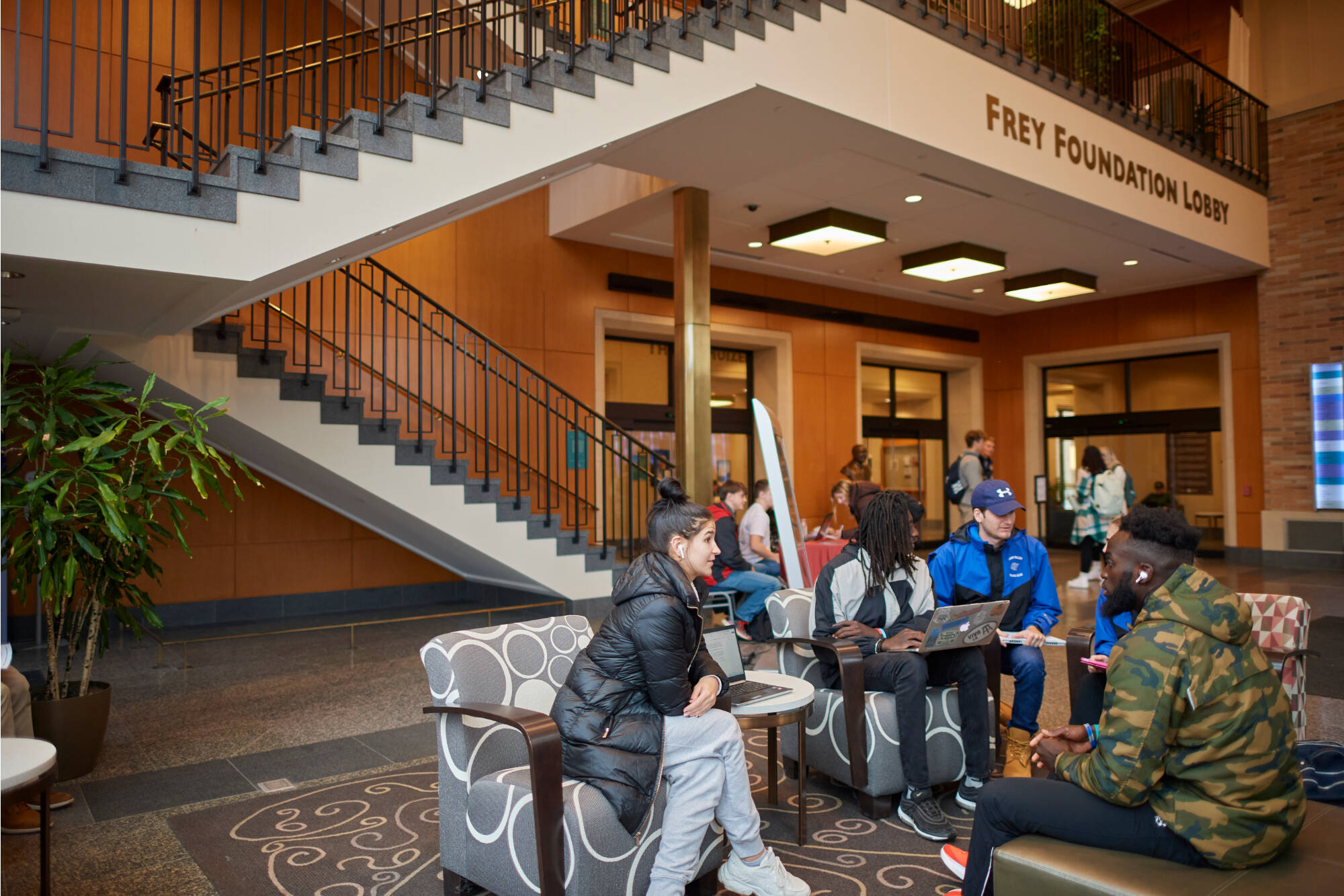 Students talking in the Seidman College of Business